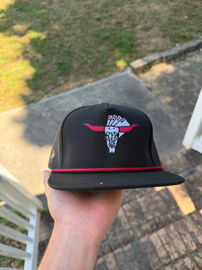 “The Rowdy Gambler” in black.